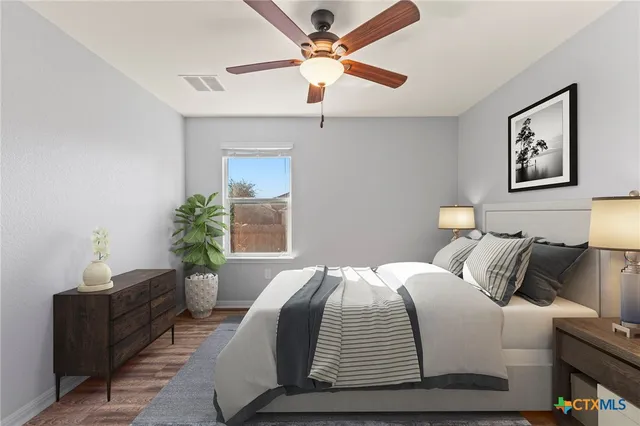 a bedroom with a bed and a couch