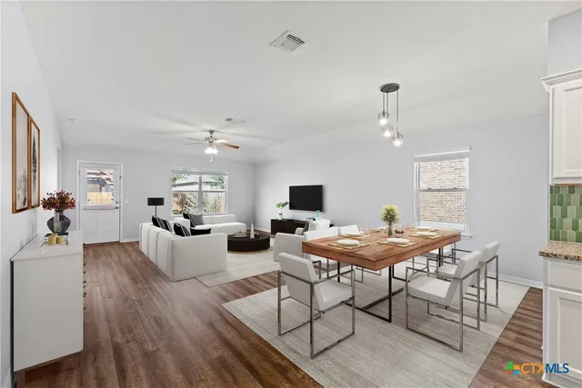 a view of a dining room with furniture