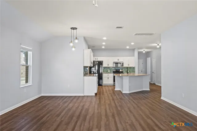 a view of kitchen with wooden floor
