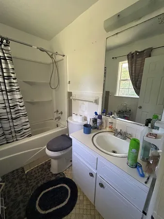 a bathroom with a toilet a sink and a bathtub