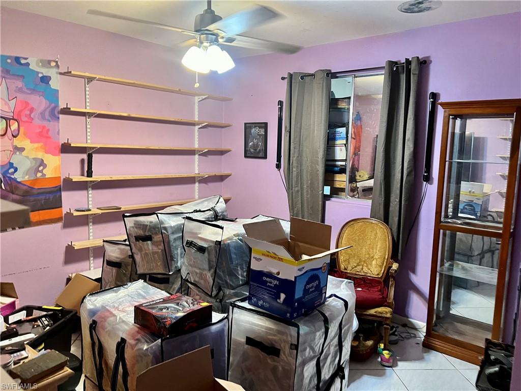 2080 Pelton Avenue Naples, FL 34112 - Photo 27 of 43 a work place with table and chairs