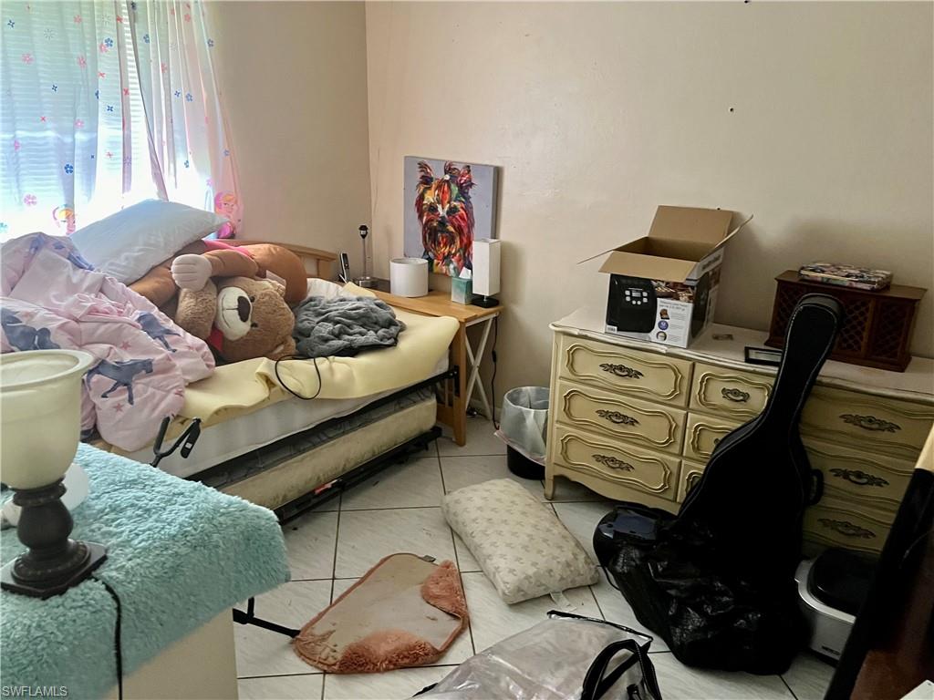 2080 Pelton Avenue Naples, FL 34112 - Photo 31 of 43 a bedroom with furniture and a window