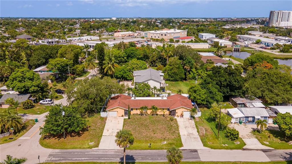 2080 Pelton Avenue Naples, FL 34112 - Photo 4 of 43 an aerial view of residential houses with outdoor space and trees