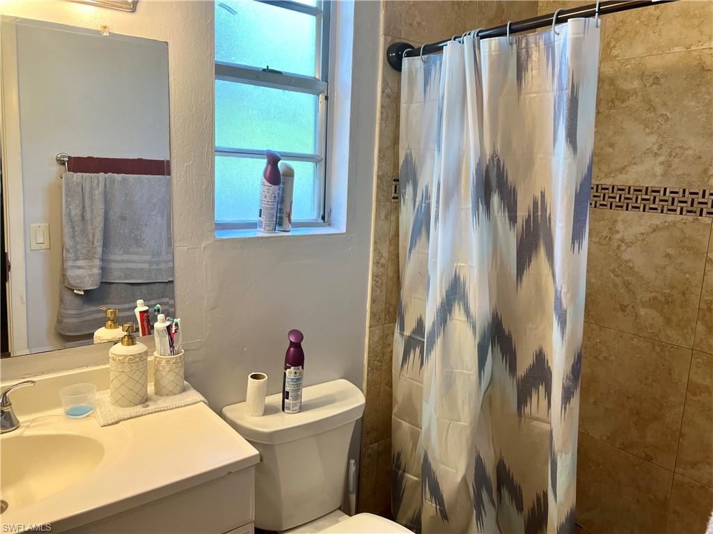 2080 Pelton Avenue Naples, FL 34112 - Photo 41 of 43 a bathroom with a sink toilet and shower