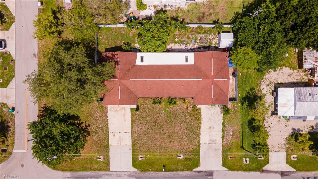 2080 Pelton Avenue Naples, FL 34112 - Photo 10 of 43 an aerial view of a residential houses with yard
