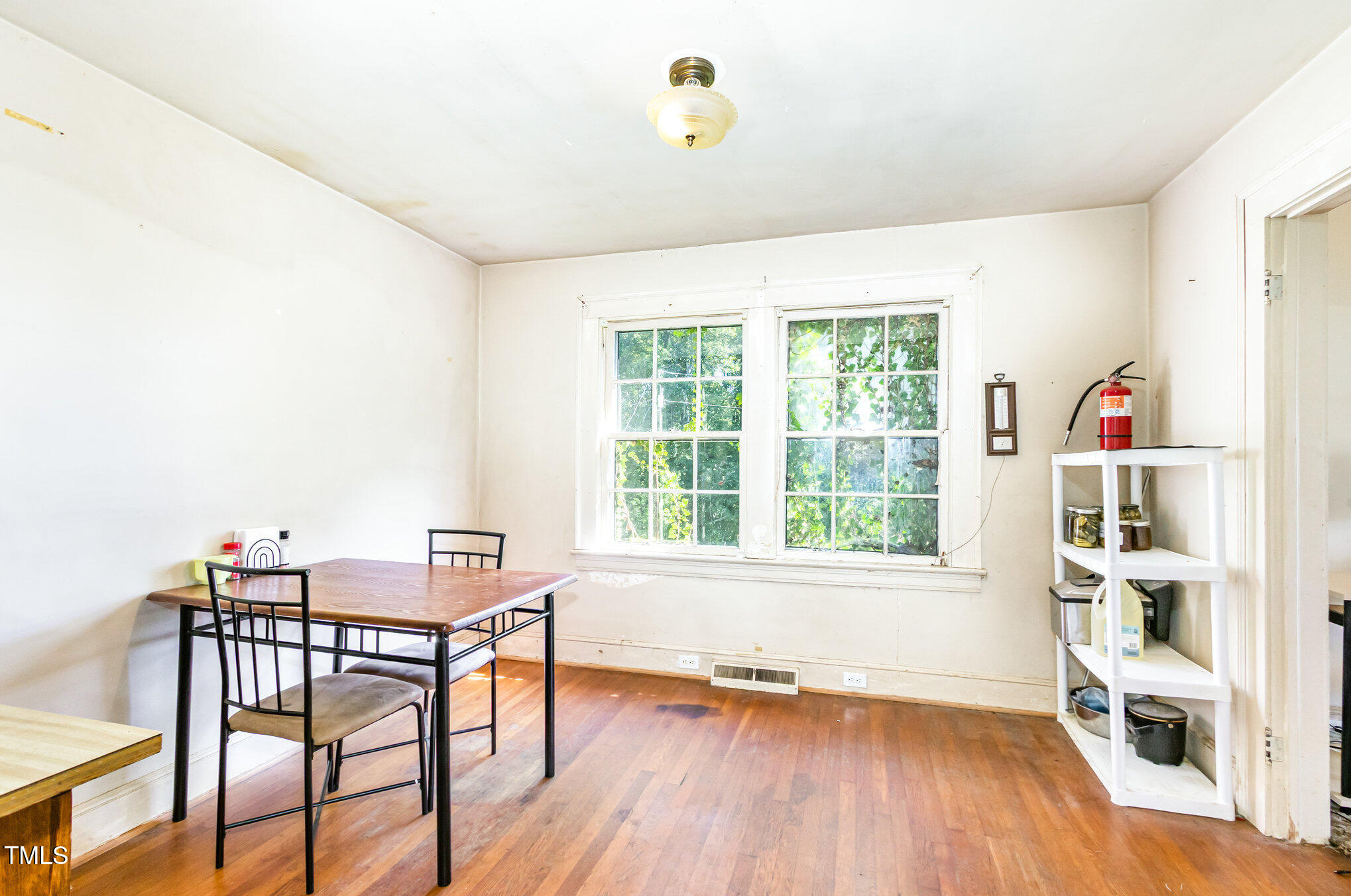 2089 Virgilina Road Roxboro, NC 27573 - Photo 10 of 32 a view of a workspace with furniture and a window