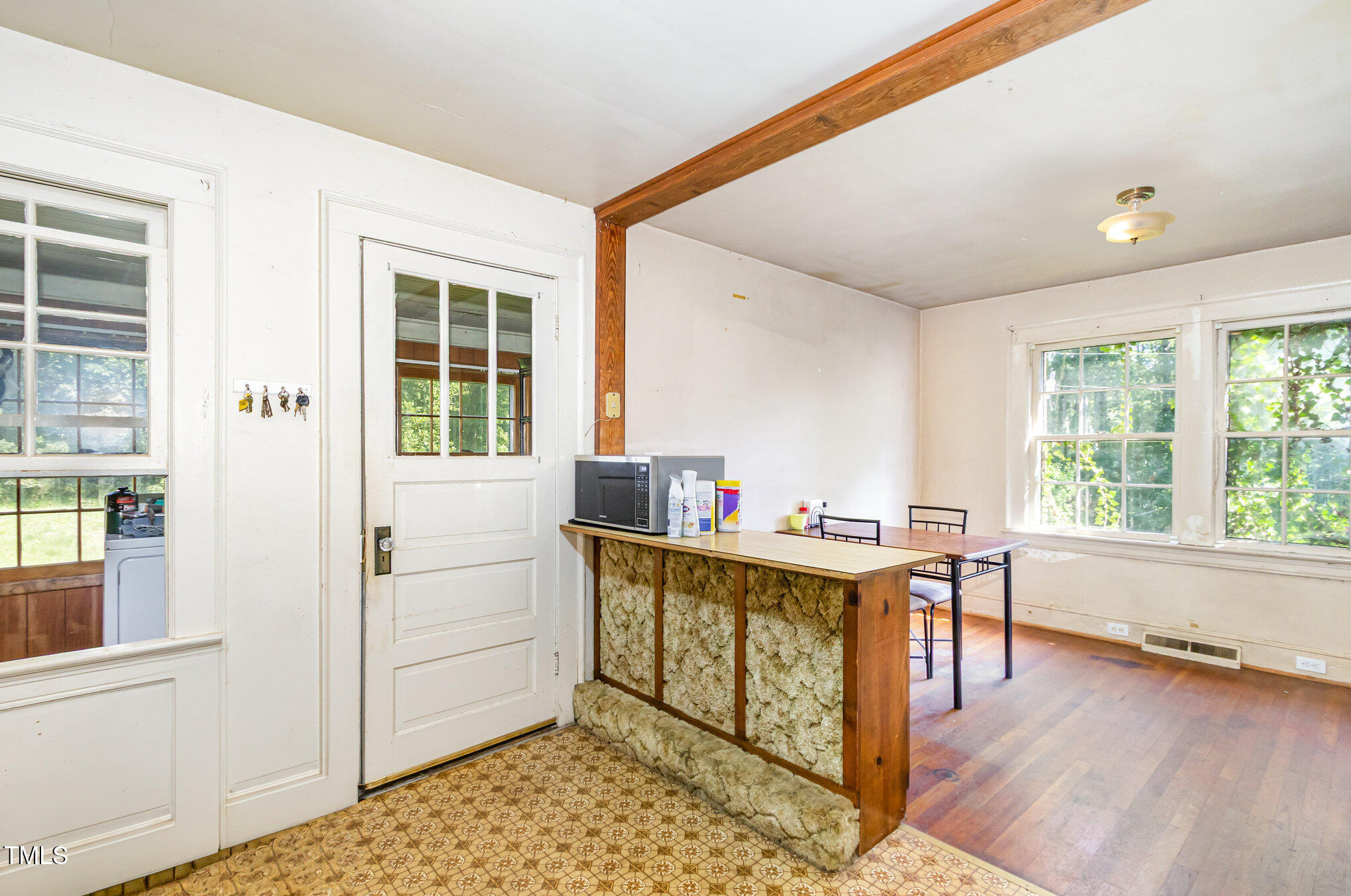 2089 Virgilina Road Roxboro, NC 27573 - Photo 15 of 32 a view of a workspace with furniture and a window