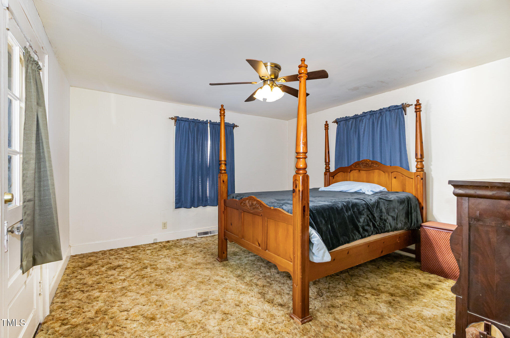 2089 Virgilina Road Roxboro, NC 27573 - Photo 18 of 32 a bedroom with a bed and a window