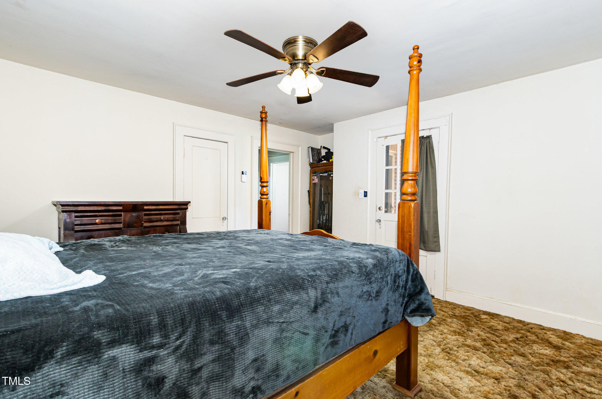 2089 Virgilina Road Roxboro, NC 27573 - Photo 19 of 32 a bedroom with bed and ceiling fan