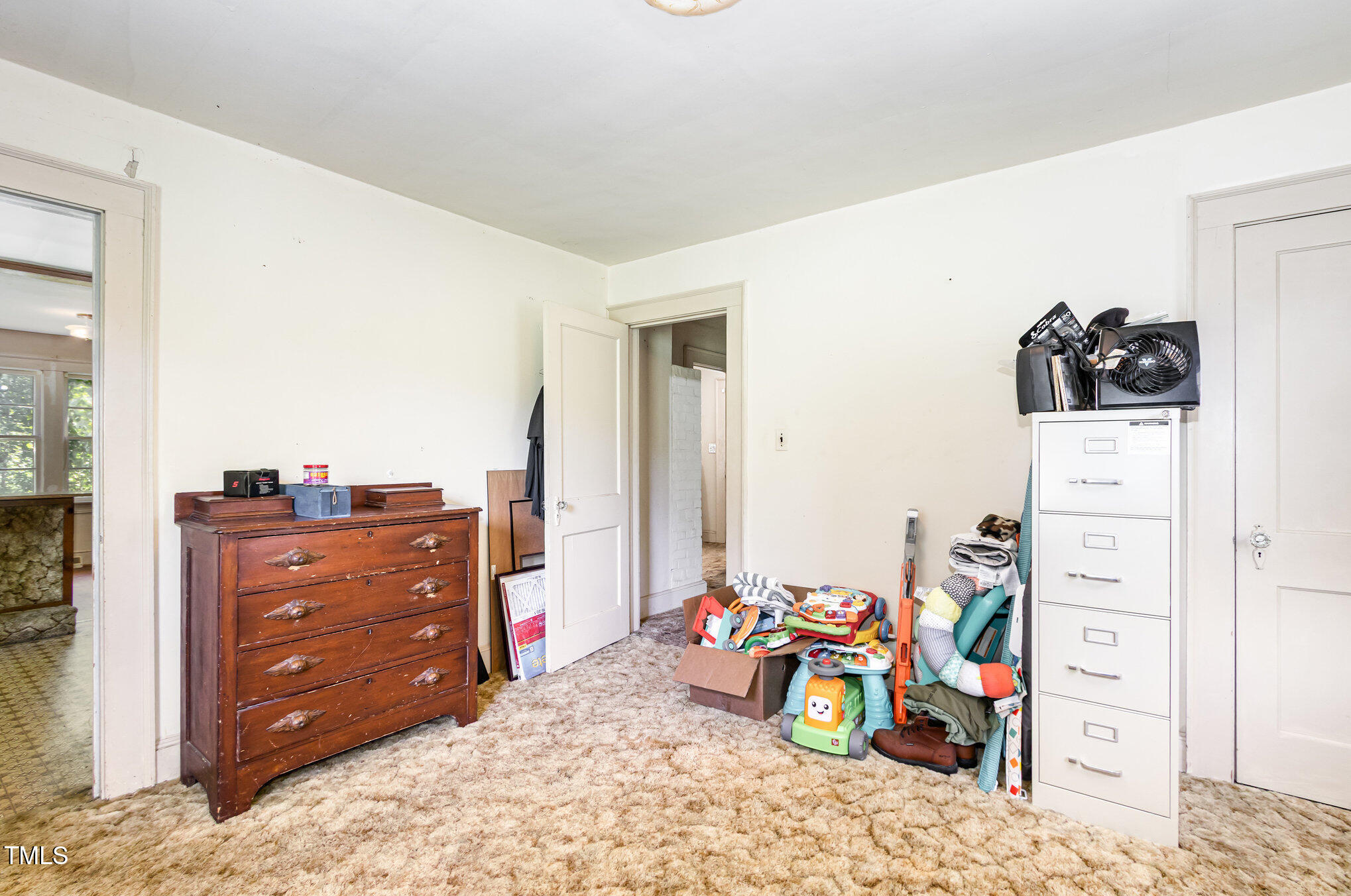 2089 Virgilina Road Roxboro, NC 27573 - Photo 21 of 32 a bedroom with a bed and a dresser