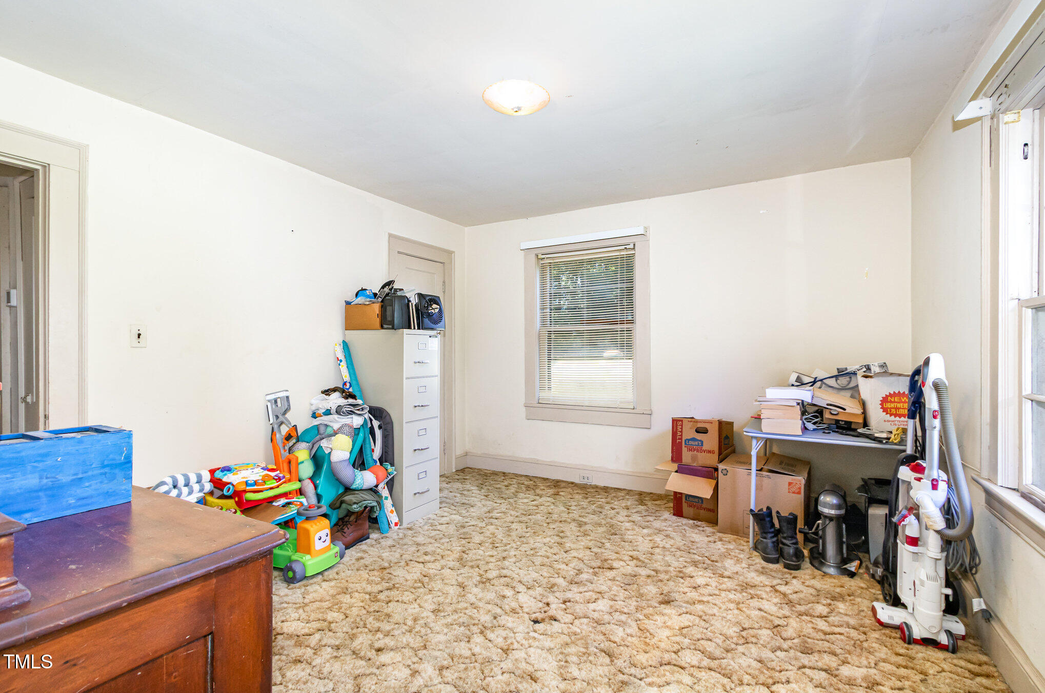 2089 Virgilina Road Roxboro, NC 27573 - Photo 22 of 32 a room with furniture and a wooden floor