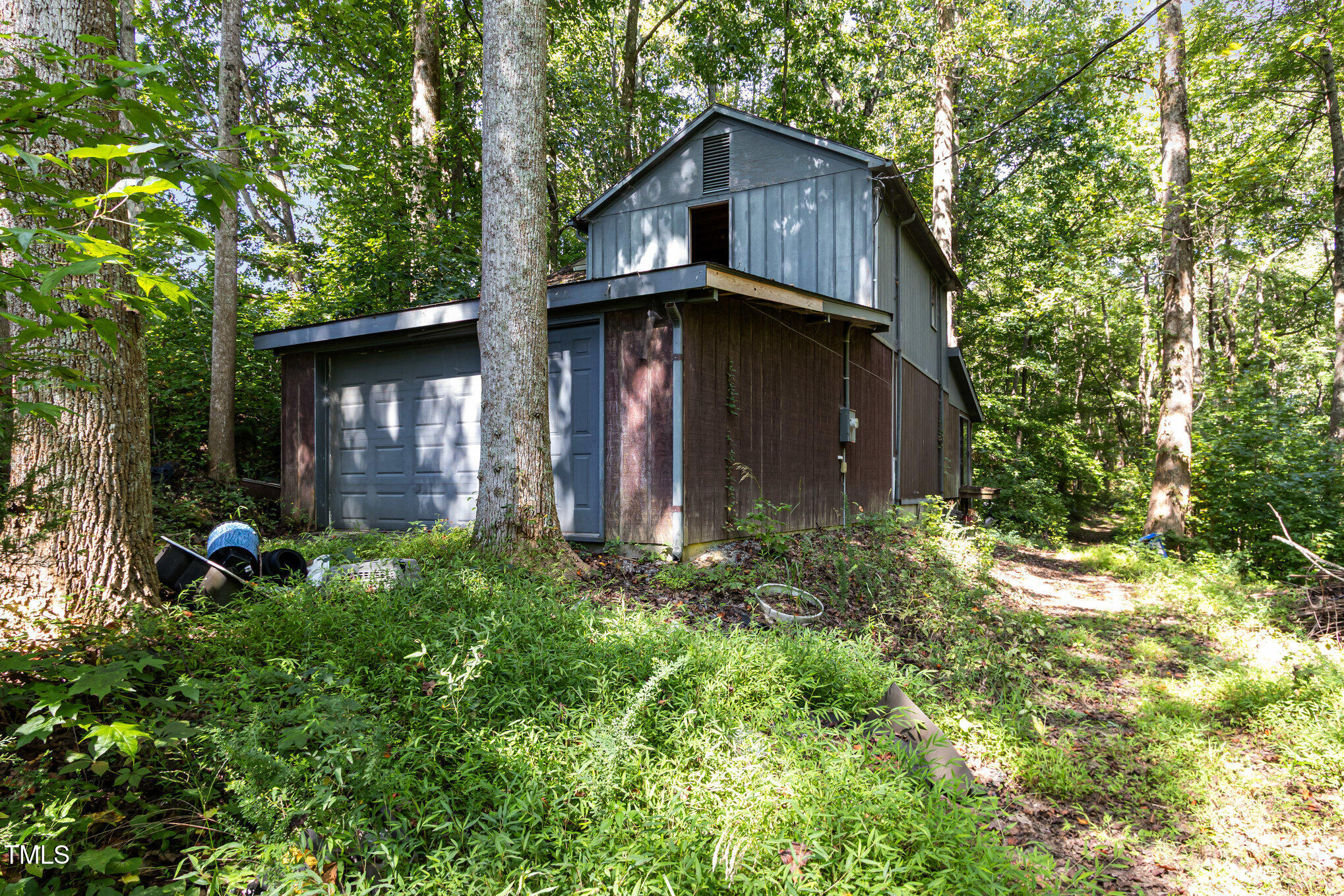 2089 Virgilina Road Roxboro, NC 27573 - Photo 27 of 32 a view of a house with a yard and plants