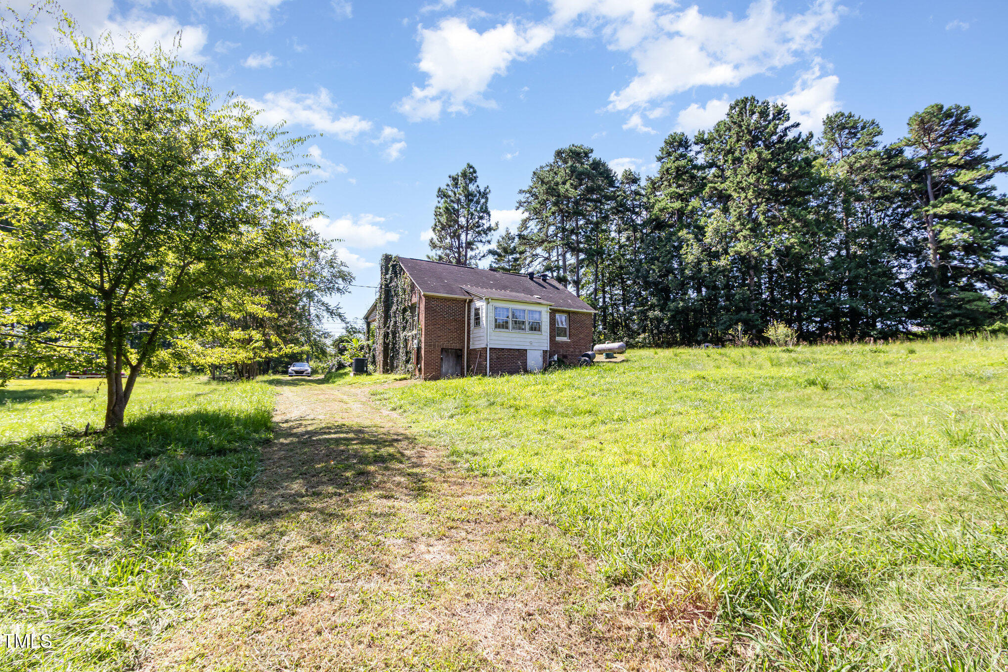 2089 Virgilina Road Roxboro, NC 27573 - Photo 30 of 32 a house view with a outdoor space