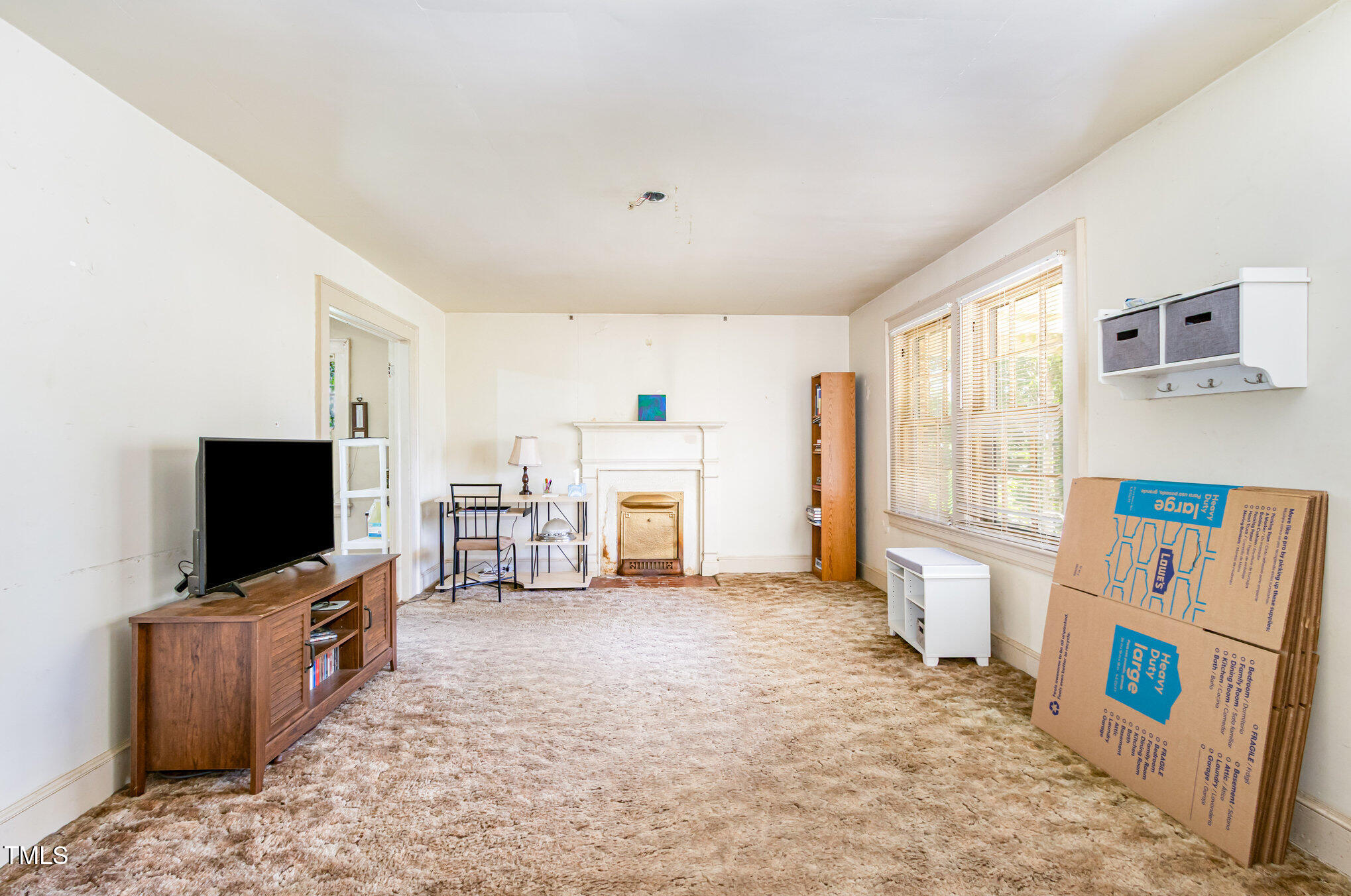 2089 Virgilina Road Roxboro, NC 27573 - Photo 6 of 32 a room with furniture and a flat screen tv