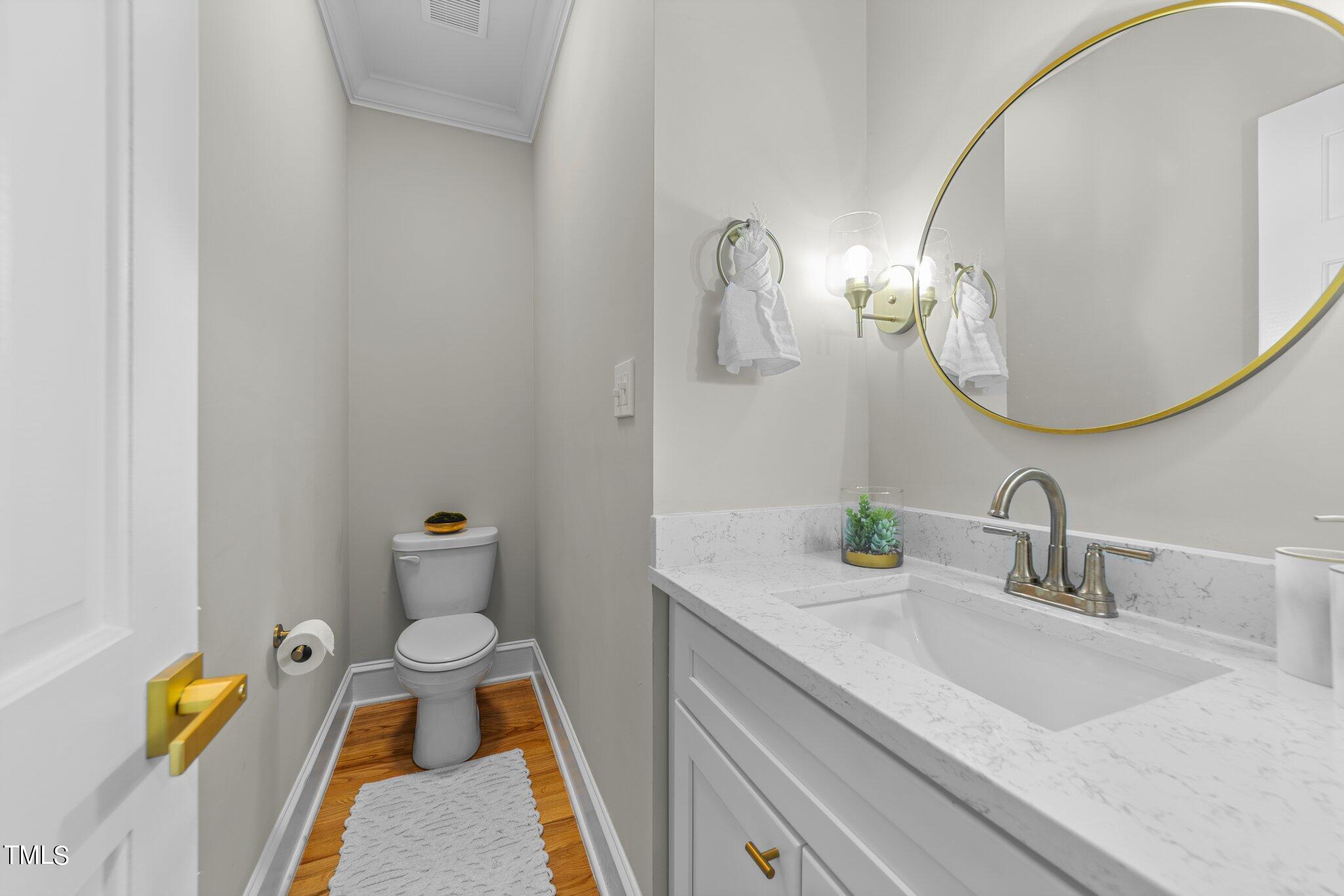 6838 Gloucester Road Raleigh, NC 27612 - Photo 12 of 36 Half bathroom