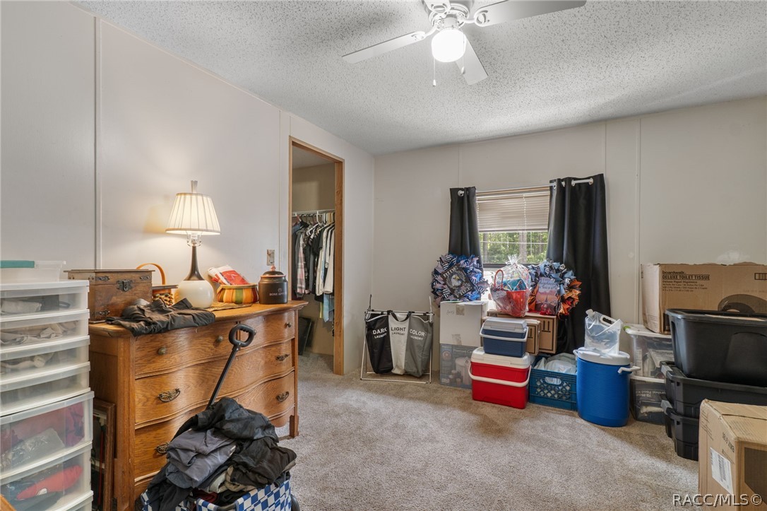 7927 West Cyprian Court Homosassa, FL 34448 - Photo 25 of 40 a room with furniture and a flat screen tv