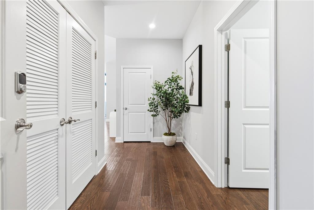 270 17th Street Northwest, Unit 4306 Atlanta, GA 30363 - Photo 2 of 37 a view of a hallway with wooden floor and closet