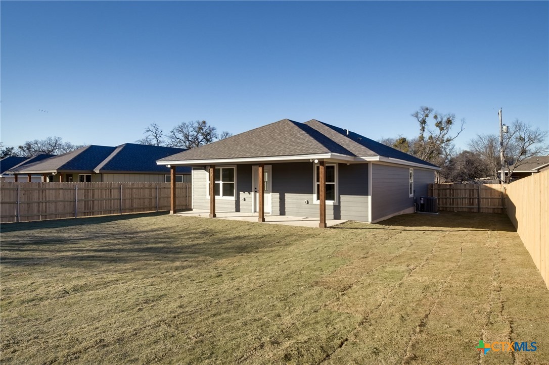 1208 Mill Street Gatesville, TX 76528 - Photo 28 of 28 a front view of a house with a garden