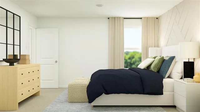 a bedroom with a bed and window
