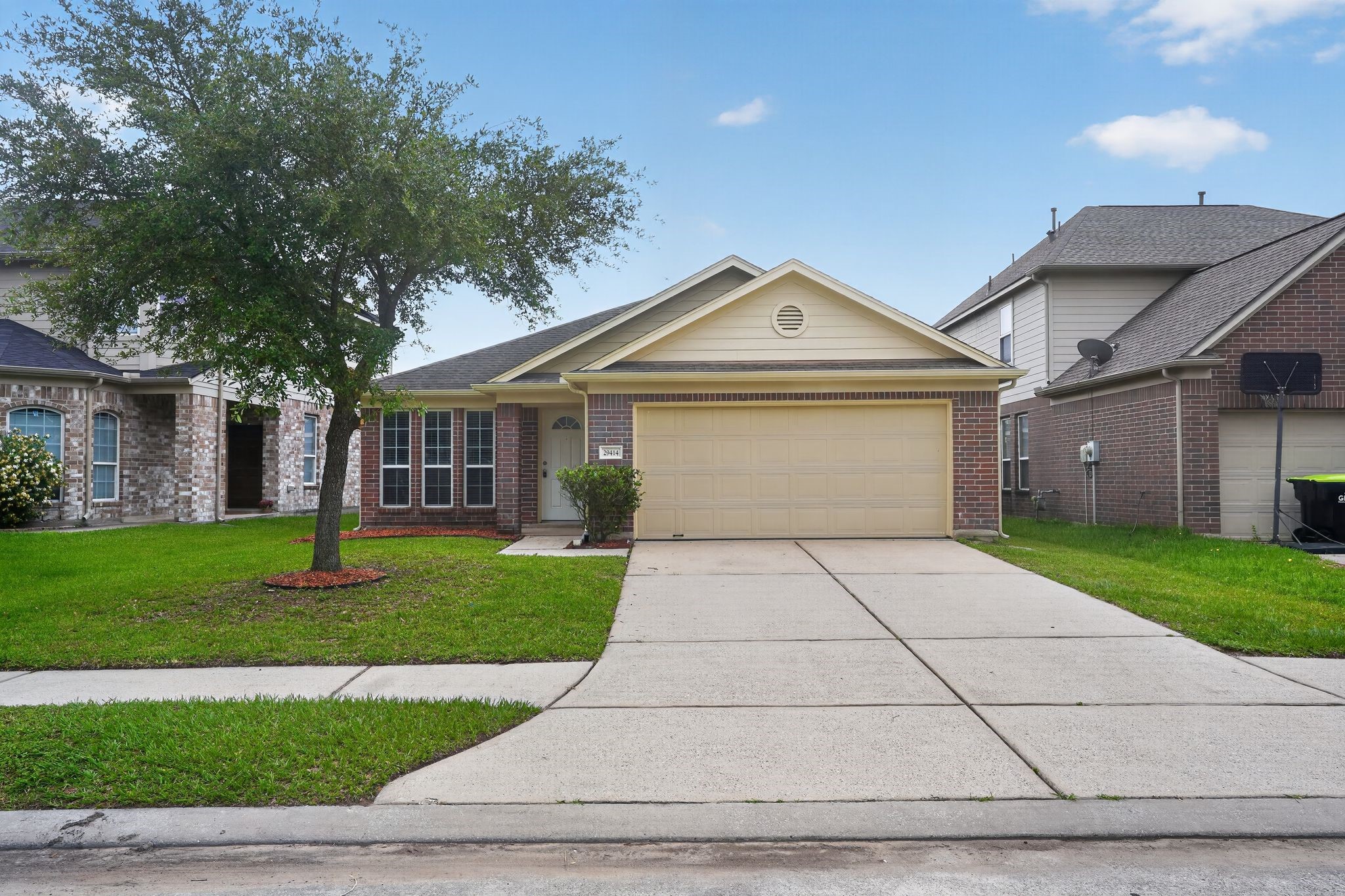 29414 Winton Wood Way Spring, TX 77386 - Photo 1 of 35 a front view of a house with a yard and trees