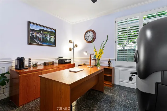 a room with table chairs and a window