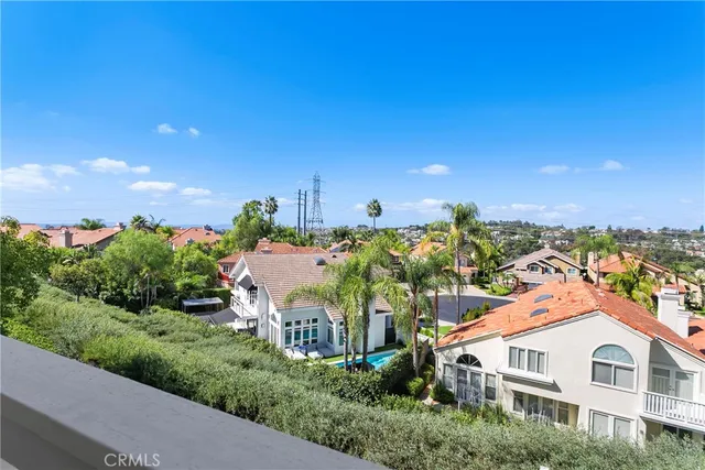 a aerial view of a house with a yard and plants