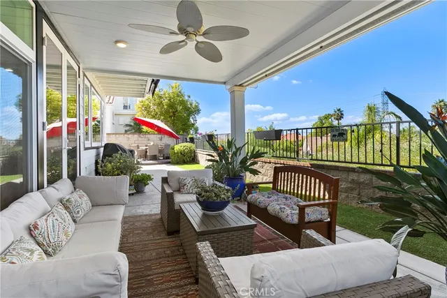a outdoor living space with furniture and a potted plant
