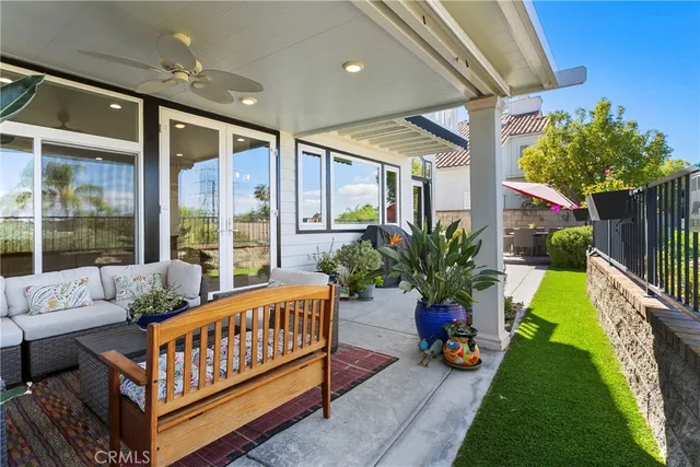 a balcony with furniture and garden view