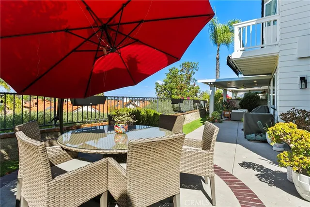 a patio with tables and chairs