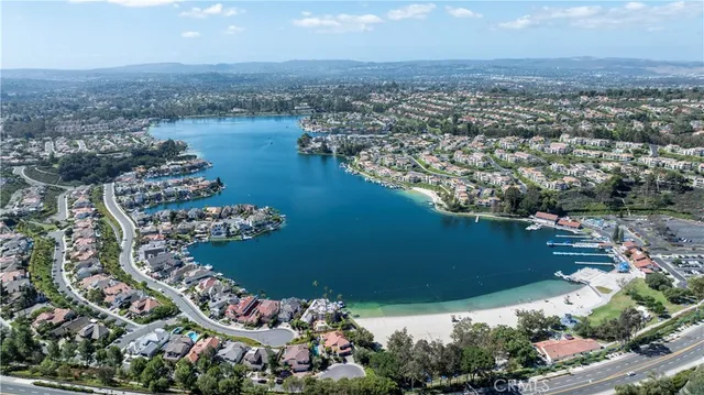 an aerial view of a house with a lake view