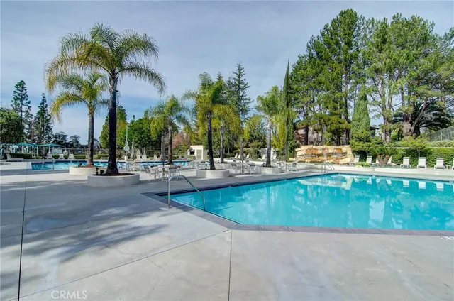 a view of outdoor space with swimming pool and lounge chair