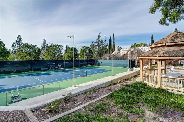 a view of a house with a yard and sitting area