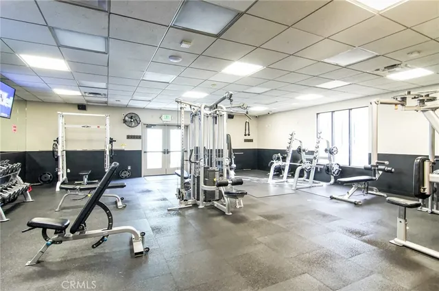 a front view of a house with a garden and a garage