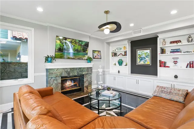 a living room with furniture and a fireplace