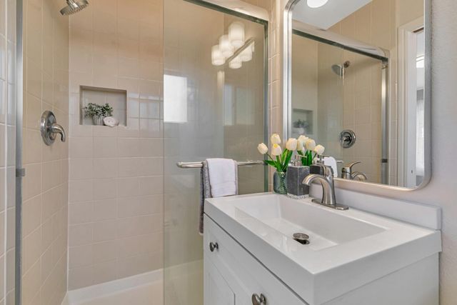 a bathroom with a sink and a mirror