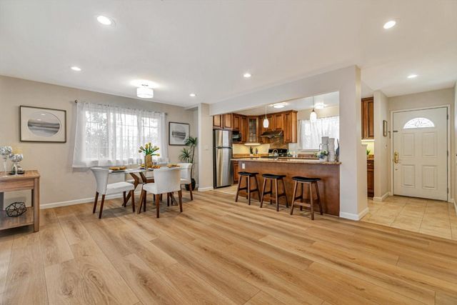 a view of a kitchen and dining room