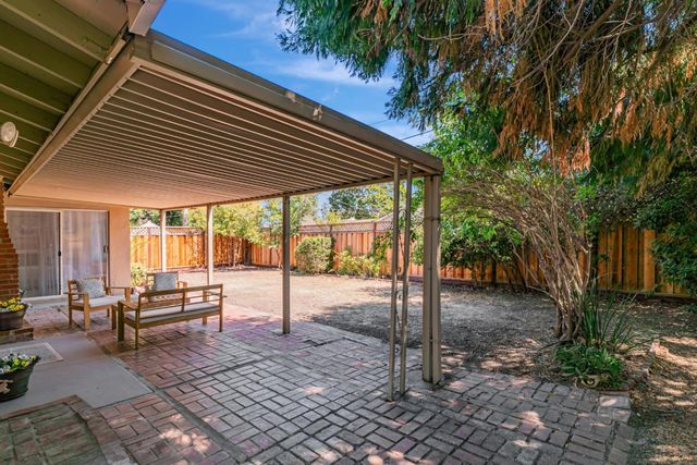 a view of a lounge chairs in the patio