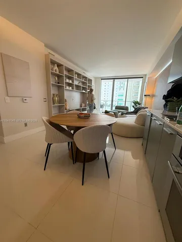 a view of a livingroom with furniture and window
