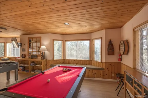 a living room with lots of furniture and a table