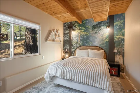 a view of bedroom with furniture and window