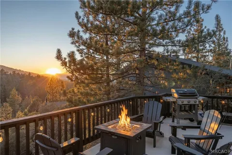 a view of a chairs and table in the balcony