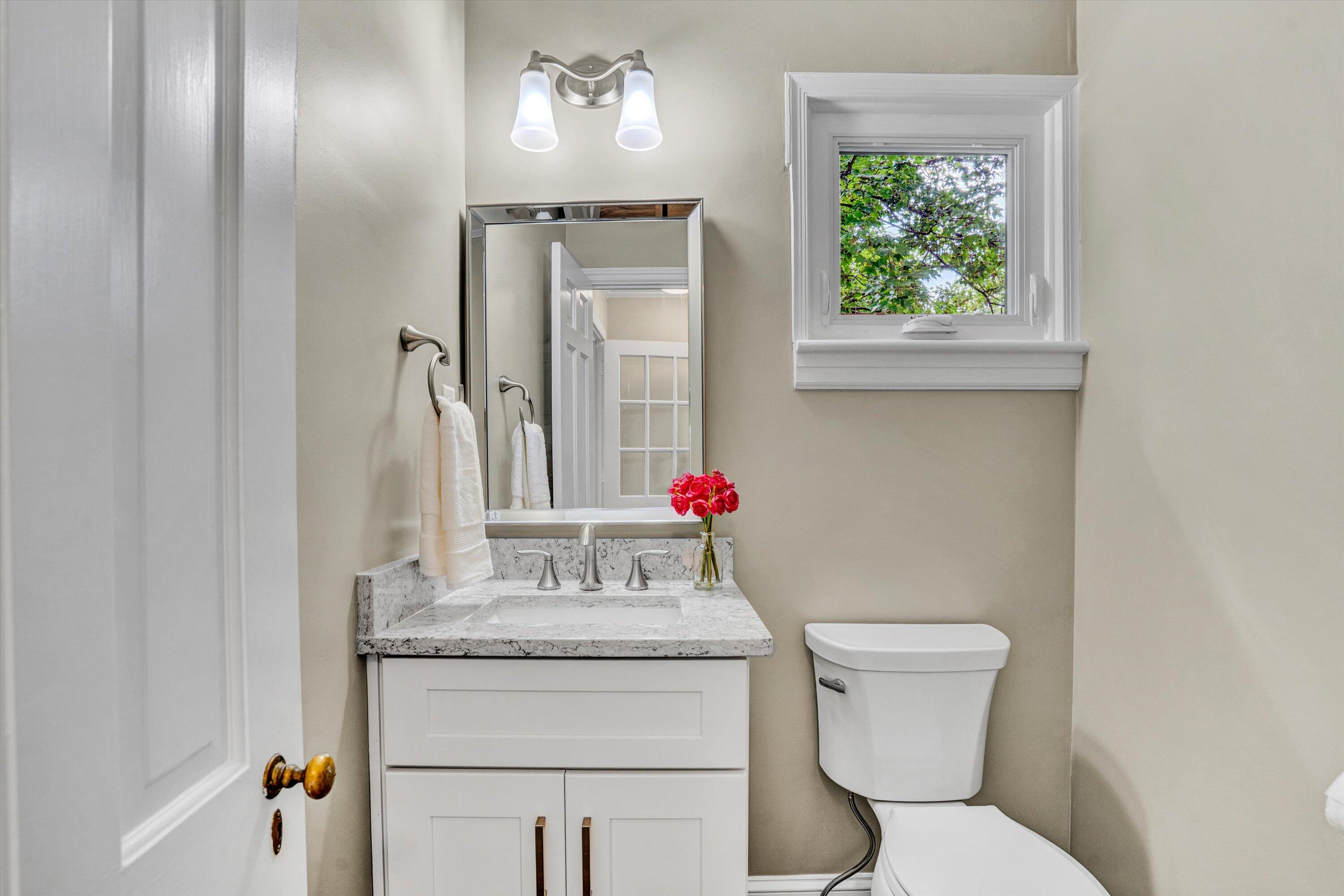 2118 Mt Vernon Road Southwest Roanoke, VA 24015 - Photo 12 of 53 a bathroom with a toilet sink and mirror