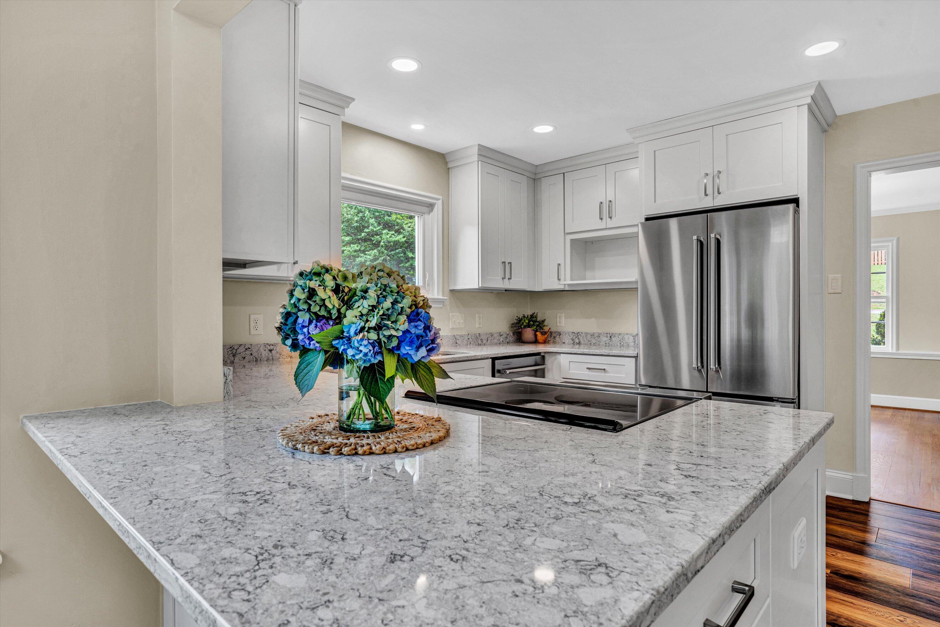 2118 Mt Vernon Road Southwest Roanoke, VA 24015 - Photo 19 of 53 a kitchen with stainless steel appliances granite countertop a refrigerator a stove and a sink