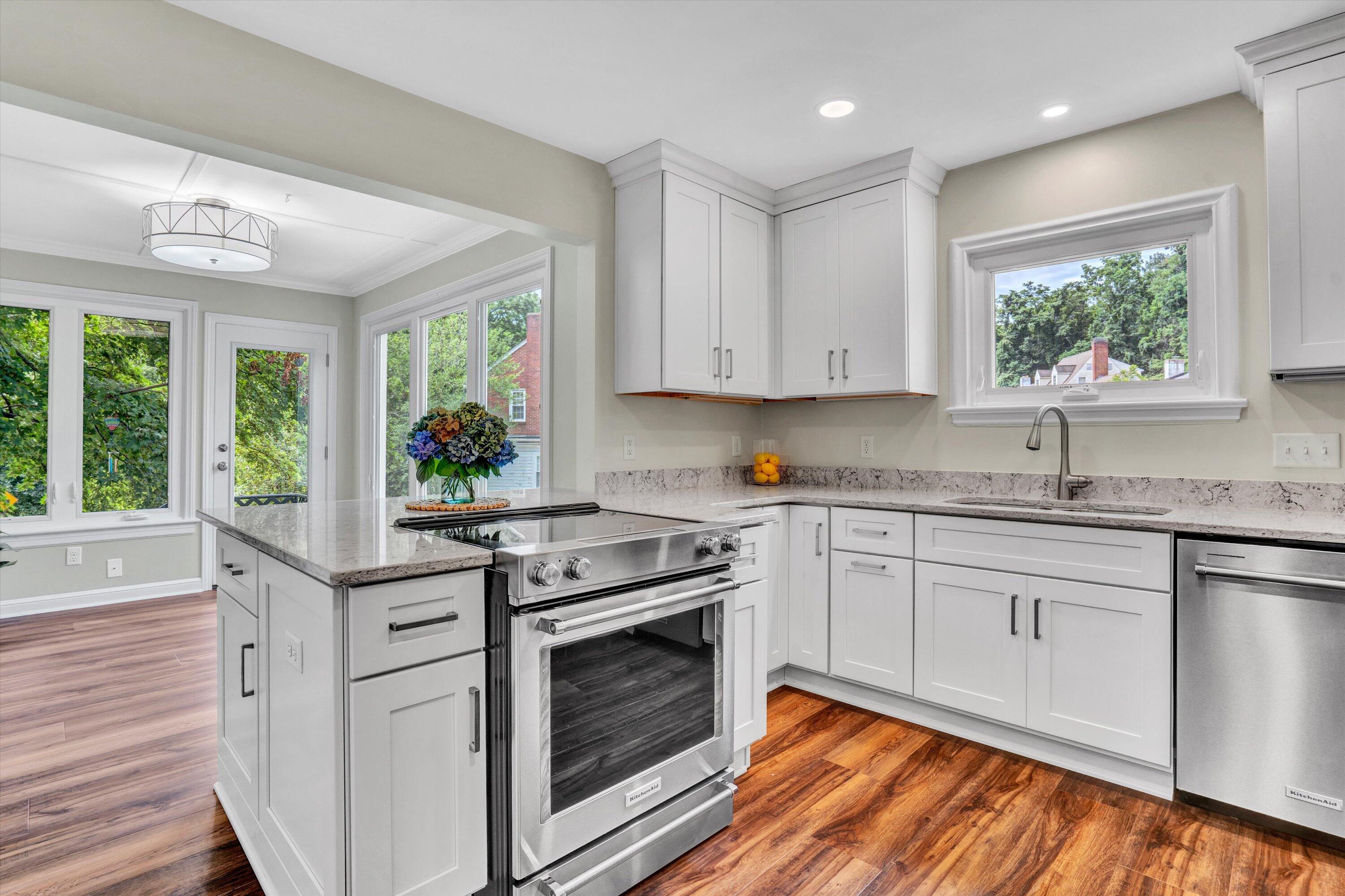 2118 Mt Vernon Road Southwest Roanoke, VA 24015 - Photo 21 of 53 a kitchen with stainless steel appliances granite countertop a stove a sink and a microwave