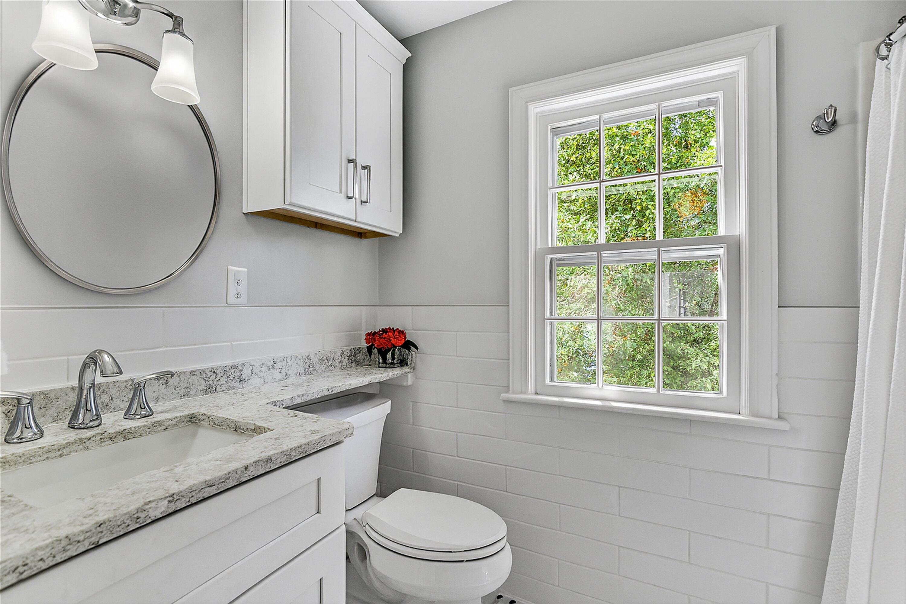 2118 Mt Vernon Road Southwest Roanoke, VA 24015 - Photo 26 of 53 a bathroom with a granite countertop toilet sink and mirror