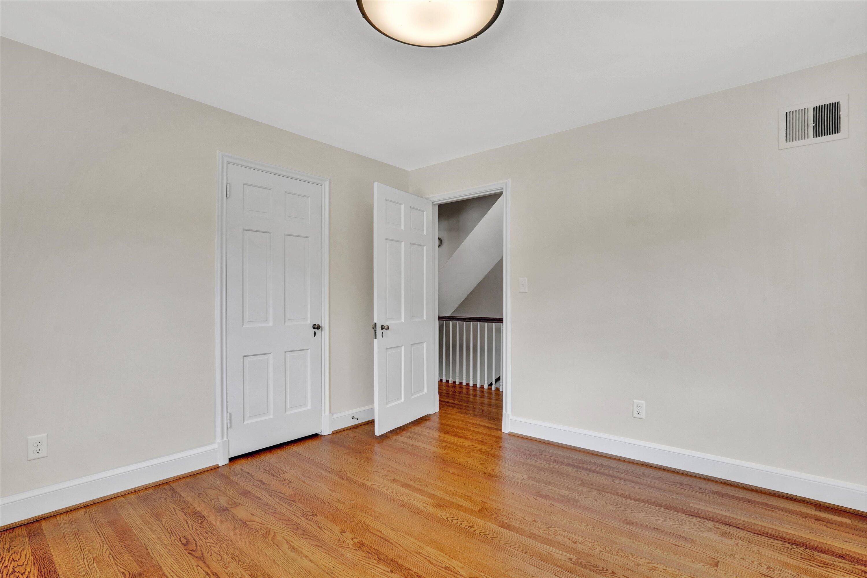 2118 Mt Vernon Road Southwest Roanoke, VA 24015 - Photo 30 of 53 a view of an empty room with wooden floor and a window