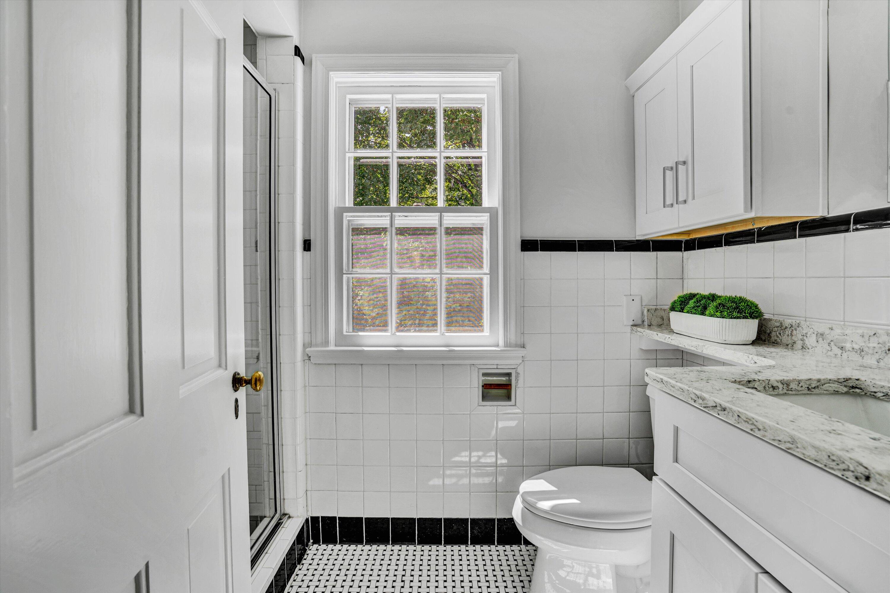 2118 Mt Vernon Road Southwest Roanoke, VA 24015 - Photo 34 of 53 a bathroom with a granite countertop sink and a toilet
