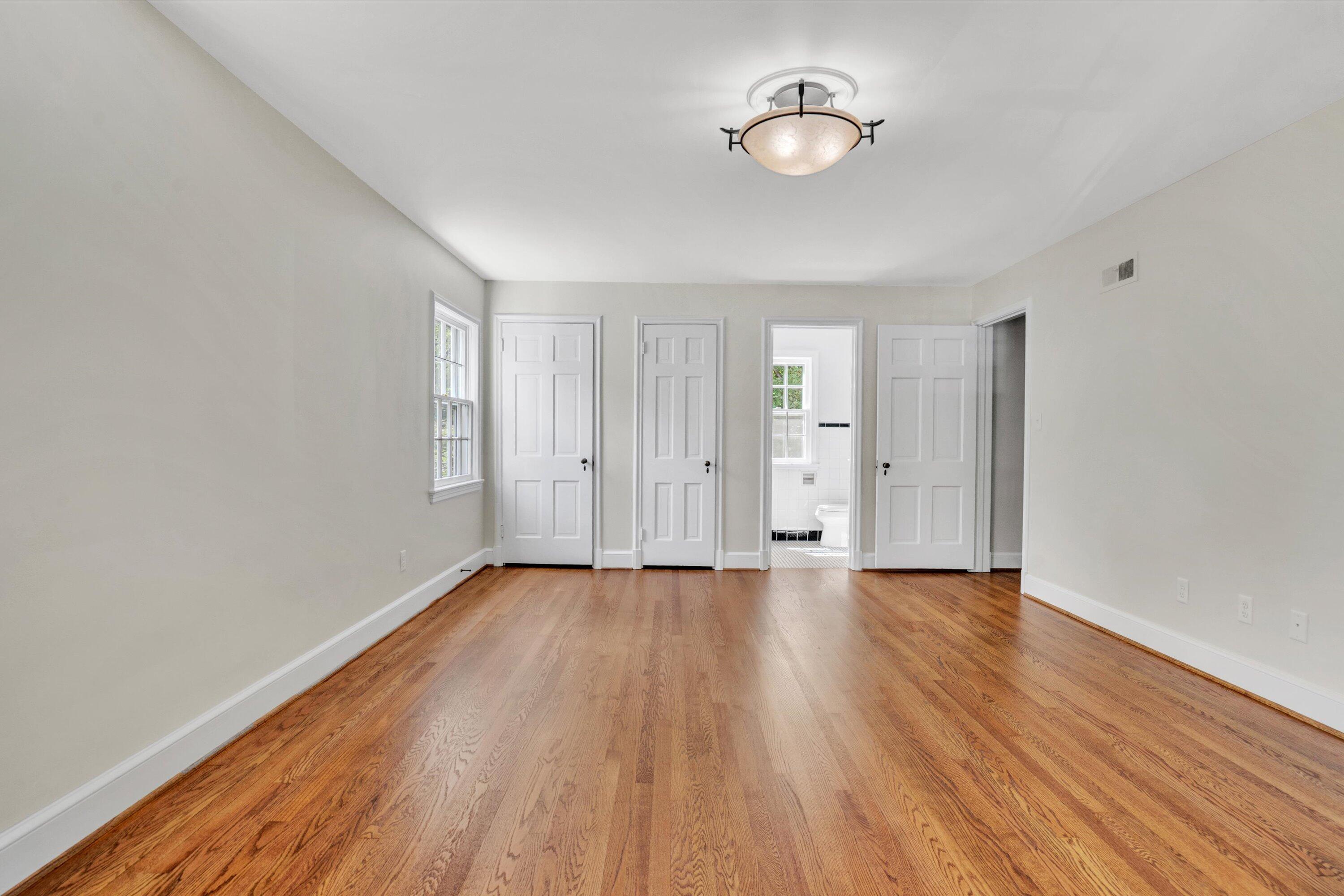 2118 Mt Vernon Road Southwest Roanoke, VA 24015 - Photo 37 of 53 an empty room with wooden floor and windows