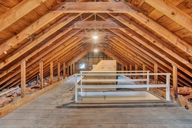 a view of an empty room with a fireplace