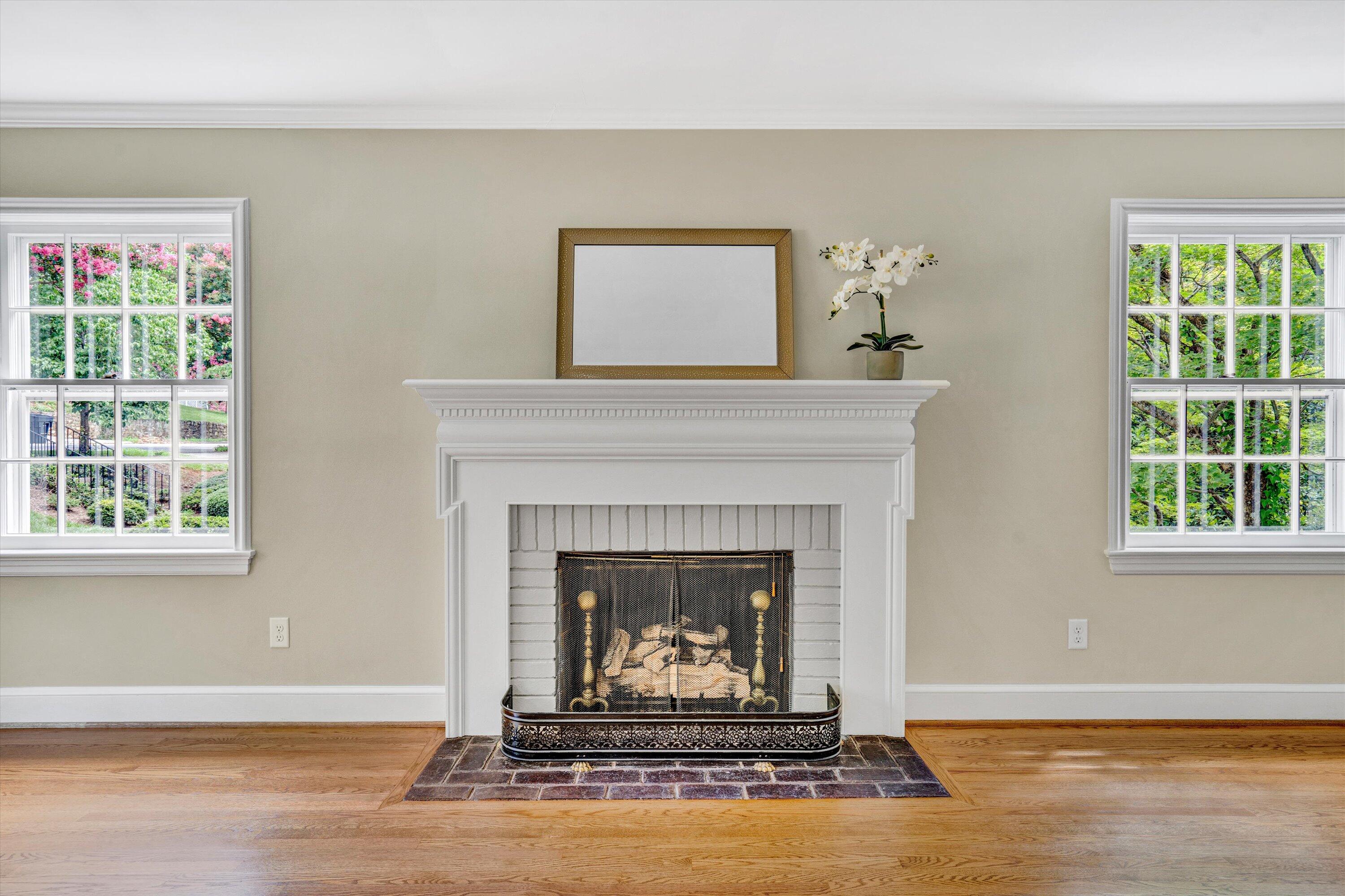 2118 Mt Vernon Road Southwest Roanoke, VA 24015 - Photo 5 of 53 a living room with a fireplace and windows